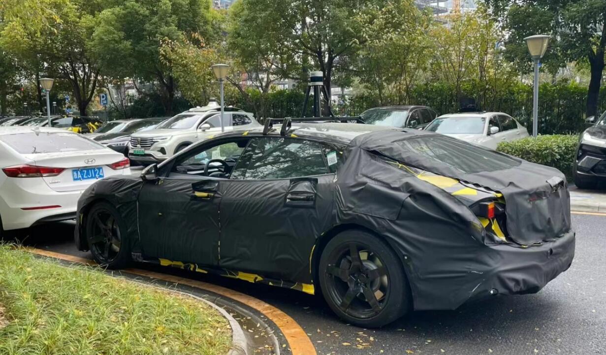 Spy photos show Lotus testing electric sedan