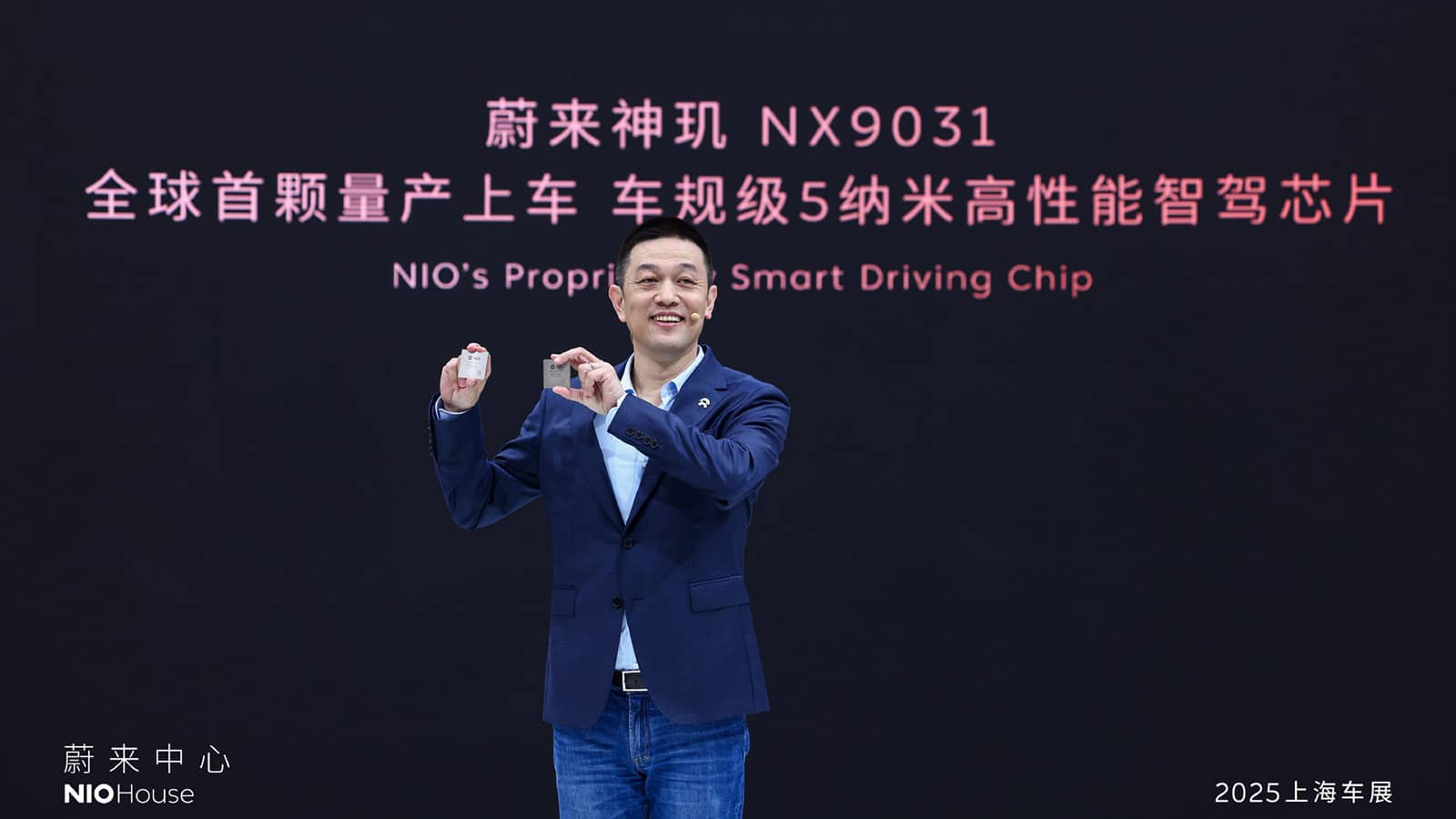 William Li, founder, chairman, and CEO of Nio, showcases the Shenji NX9031 chip at the 2025 Shanghai Auto Show.